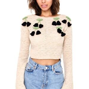 Adorable Cream Crop Sweater with knit flower details!